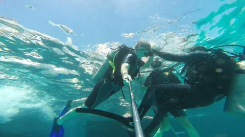 People diving under the warm cyan water. Stock Footage 62534625