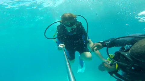 People diving under the warm cyan water. Stock Footage 62548660