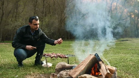 People do barbecue at the nature Stock Footage 62638834
