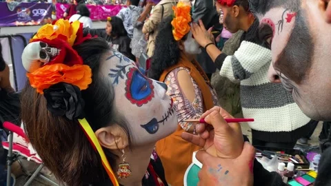 People do Catrina make ups ahead of Day of the Dead holiday, Mexico City 4K Stock Footage 289580633