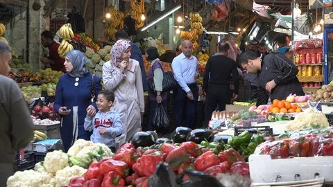 People do grocery shopping in food bazaar in Amman, Jordan Stock Footage