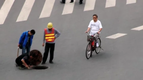 People do roadwork at the central square of the city in Xian, China. Stock Footage 64946579