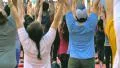 People do yoga in Times Square NYC as part of the International Day of Yoga HD Footage