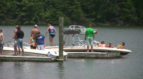 People on dock getting ready to boat Stock Footage 488370