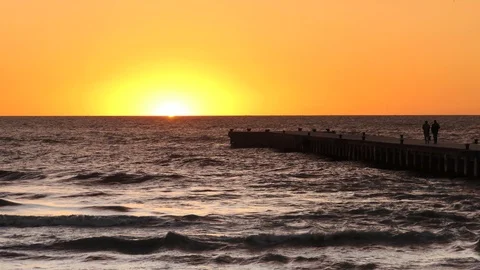 People on the dock at sunset Stock Footage 96580791