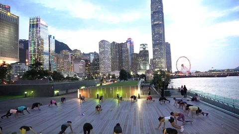 People doing workout in Tamar Park, Hong Kong Video stock 124987331