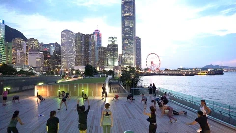 People doing workout in Tamar Park, Hong Kong 库存影片 124987350