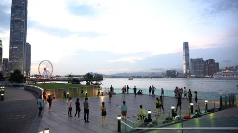 People doing workout in Tamar Park, Hong Kong Stock Footage 124987413