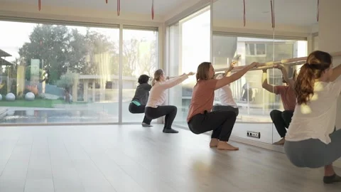 People doing yoga doing exercise in barre Video stock 147574294
