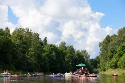 People drafting in the river at the Kaljakellunta (Beer Floating) festival Stock Photos