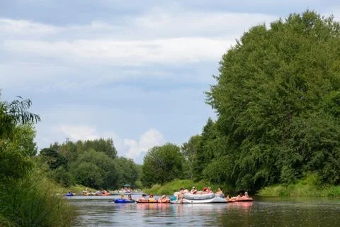 People drafting in the river at the Kaljakellunta (Beer Floating) festival Stock Photos