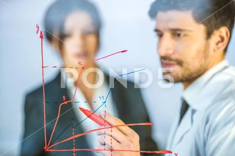 The people draw the graph at the virtual screen Stock Photos