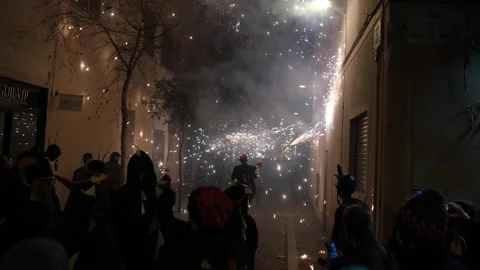 People dressed up as devil enjoy fireworks Correfoc Catalan in Barcelona Stock Footage 171770367