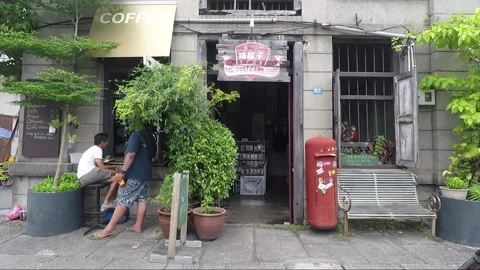 People drink coffee at the Post Card Shop, George Town, Penang, Malaysia Stock Footage 160912467