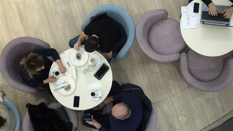 People drink coffee at a table. Top view Stock Footage 124769898