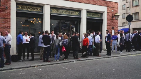 People drinking and talking outside london pub and restaurant Stock Footage 146243548
