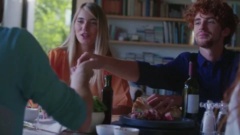 People drinking, eating and talking.Four caucasian friends man and woman Stock Footage 81491834