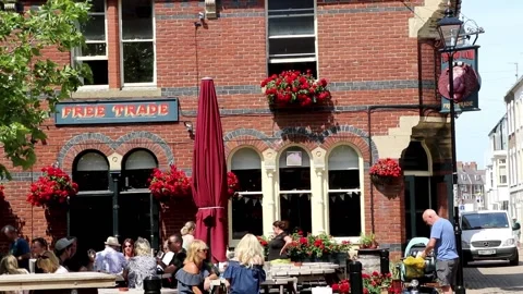 People drinking at the red lion pub front section old harbour 스톡 동영상 137274569