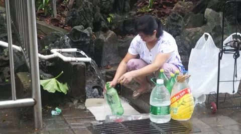 People in the drinking spring water Stock Footage 64066642