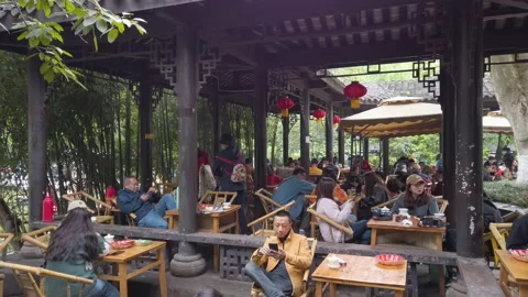 People drinking tea in People's Park at weekend in spring, Chengdu, China. Stock Footage 157340545