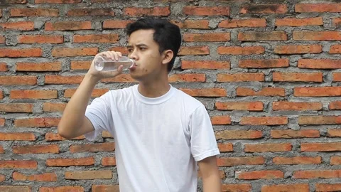 People drinking water in bottle Stock Footage 312081382