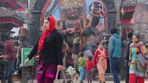 People at the durbar square in front of the statue of Kala Bhairava Video stock 59138612