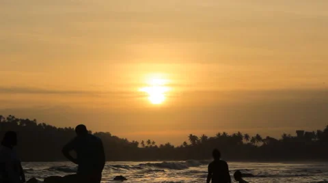 People during sunset on the beach Stock Footage 67247259