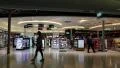 People in duty free area inside Bangkok international airport in Thailand HD Footage