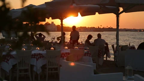 People eating and drinking on the luxury seaside outdoor restaurant. Stock Footage