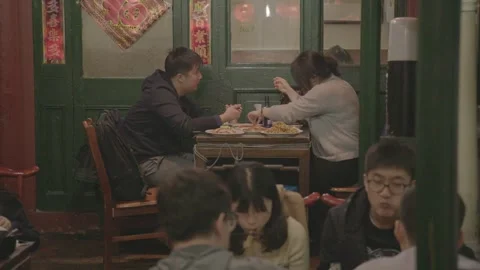 People Eating and Socializing Inside a Casual Restaurant in Beijing, China Stock Footage 345771435