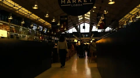 People Eating and Walking Inside Time Out Market Lisboa Food Court Stock Footage 334101904