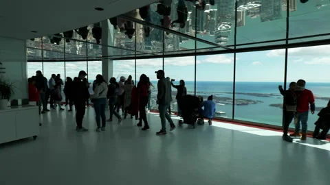 People eating in cafe, looking at view, CN Tower interior, wide angle pan Stock Footage 192035376