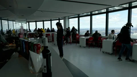 People eating in cafe, looking at view, CN Tower interior Stock Footage 192036541