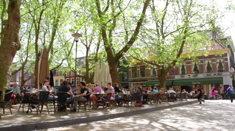 People eating lunch on outside terrace in holland Stock Footage