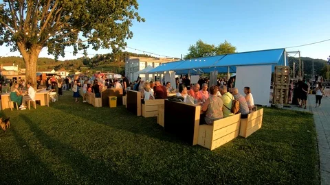 PEOPLE EATING IN SUNSET Stock Footage 93581938