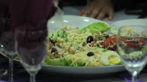 People eating at a table during a party. Food Vídeo Stock 46314770