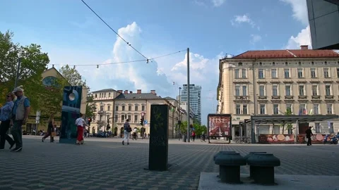 People either standing or walking in wide street in Ljubljana, Slovenia Stock Footage 155880543