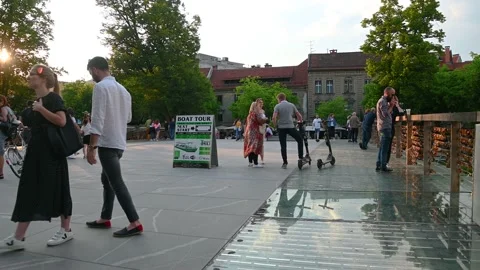People either standing or walking on famous Butcher's bridge in Ljubljana Stock Footage 155881023
