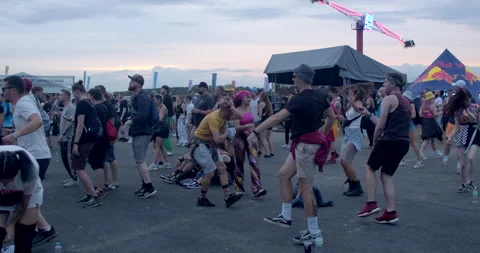 People energetically move on the dance floor at a drum and bass music festival. Stock Footage 255092461