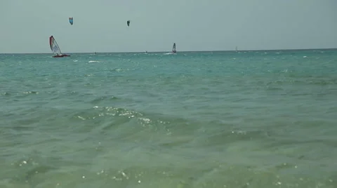 People Engaged in Windsurfing in Sea and One of Them Falls Stock Footage 59887375