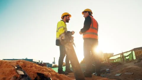 People, engineer and team talking for construction, building development and Stock Photos