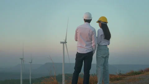 People  engineer are wearing a protective helmet on head, using tablet Analyt Stockbeeldmateriaal 149060976