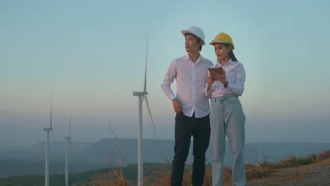 People  engineer are wearing a protective helmet on head, using tablet Analyt Stock Footage 149060992