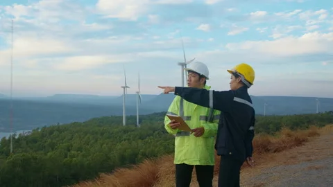 People engineer are wearing a protective helmet on head, using tablet Analyti 库存影片 169239350
