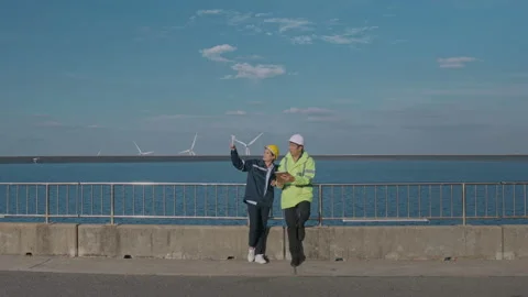 People engineer are wearing a protective helmet on head, using tablet Analyti 스톡 동영상 169240206