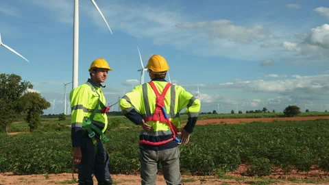 People engineer are wearing a protective helmet on head, talking to each ot.. Stock Footage 269098076