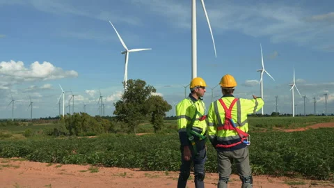 People engineer are wearing a protective helmet on head, talking to each ot.. Stock Footage 269098092