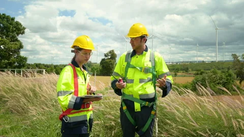 People engineer are wearing a protective helmet on head, using tablet Analy.. Stock Footage 269100013