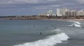 People enjoy in beach ocean waves at Portimao Portugal 4k or 4k+ Resolution