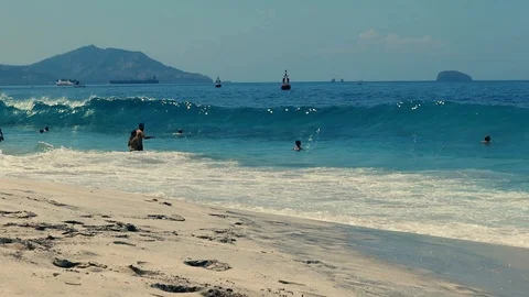 People Enjoy on Ocean Beach Surf Waves Slow Motion Stock Footage 108220618